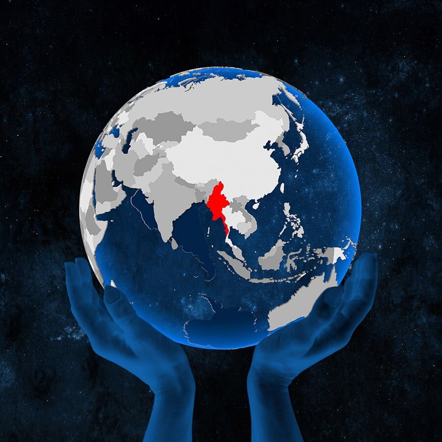Myanmar on translucent blue globe held in hands in space. 3D illustration.