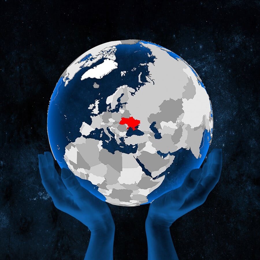 Ukraine on translucent blue globe held in hands in space. 3D illustration.